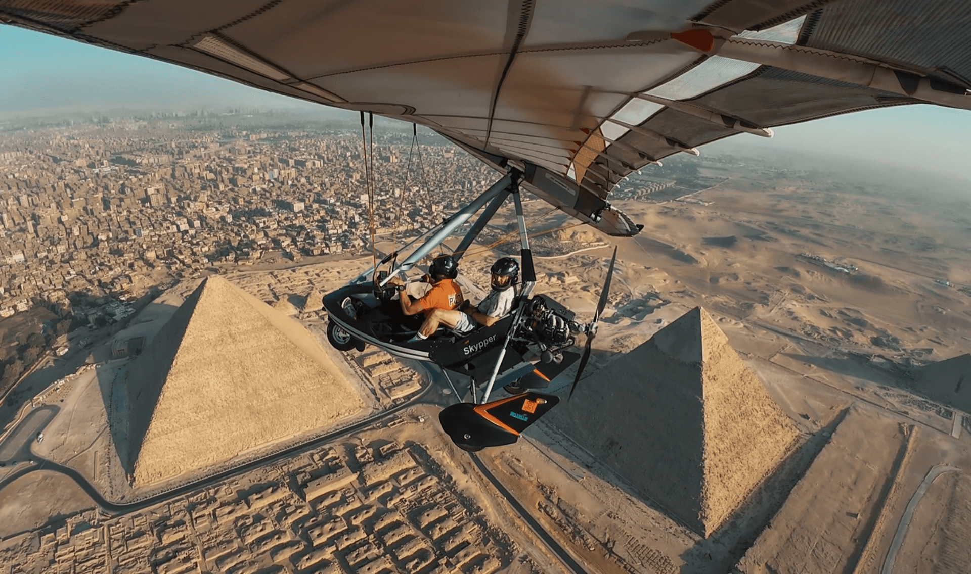 Microlight wing over the Pyramids of Giza